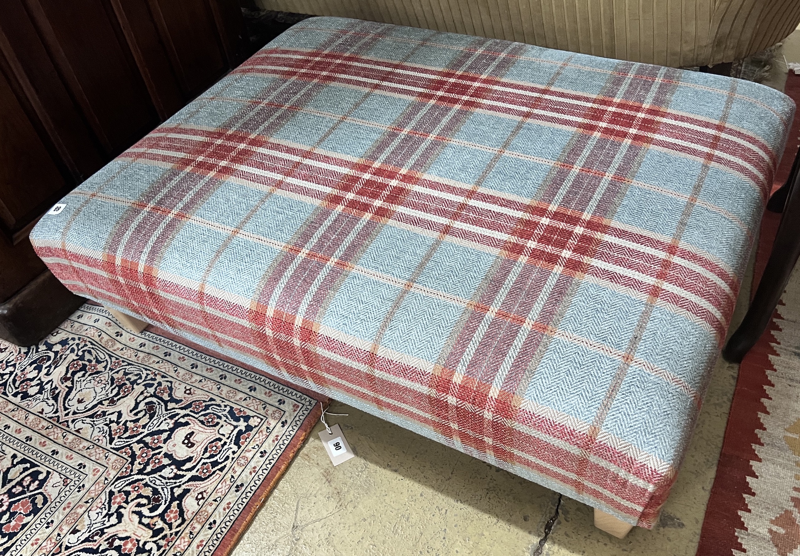 A large rectangular contemporary footstool upholstered in Colefax & Fowler tartan fabric, length 102cm, width 82cm, height 27cm